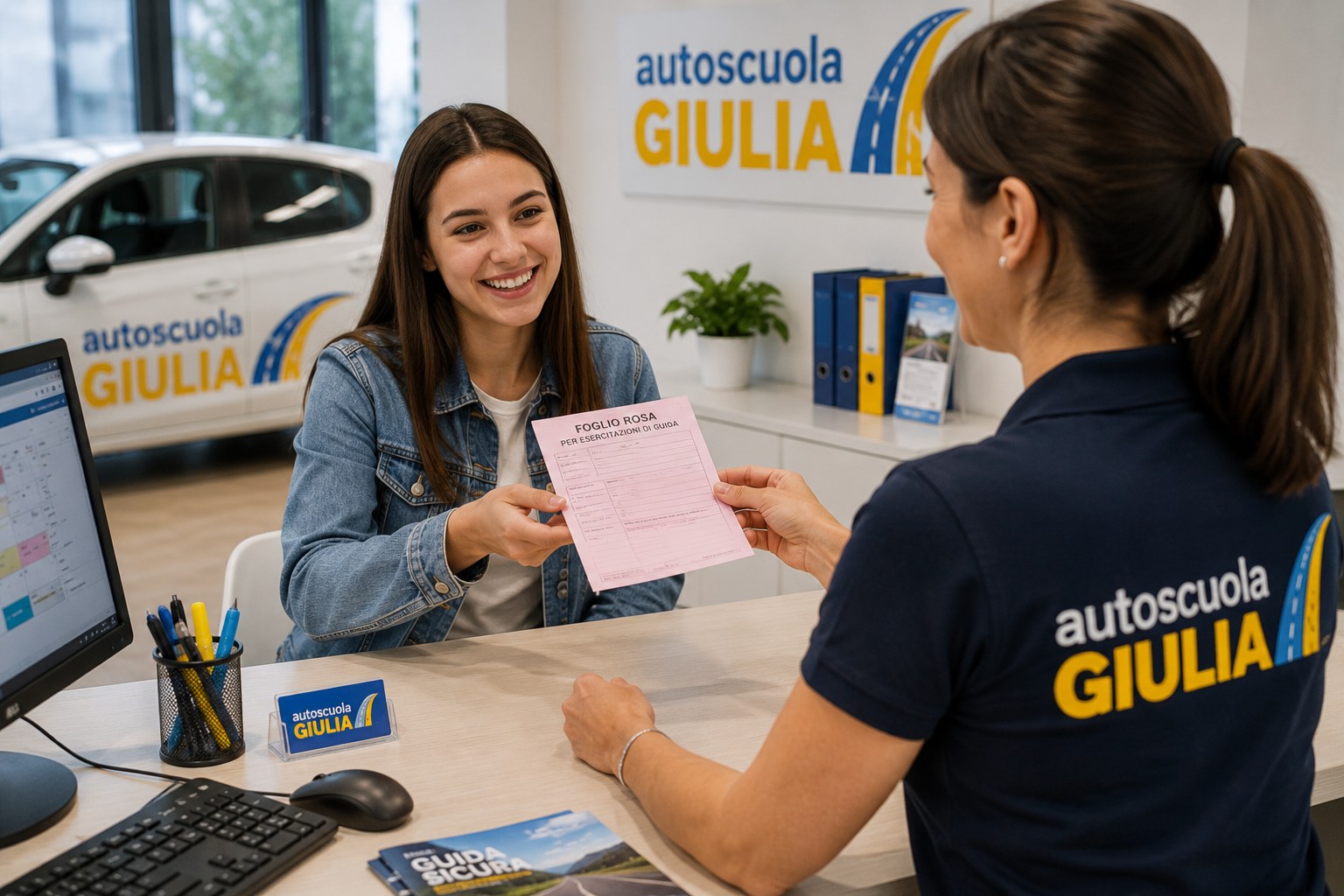 Consegna del foglio rosa in reception da parte del personale di Autoscuola Giulia